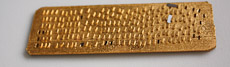 Sheet of what appear to be gold plated spacers