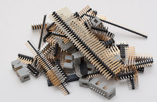 Pile of manufacturing defect gold plated connector pins from various PC interfaces
